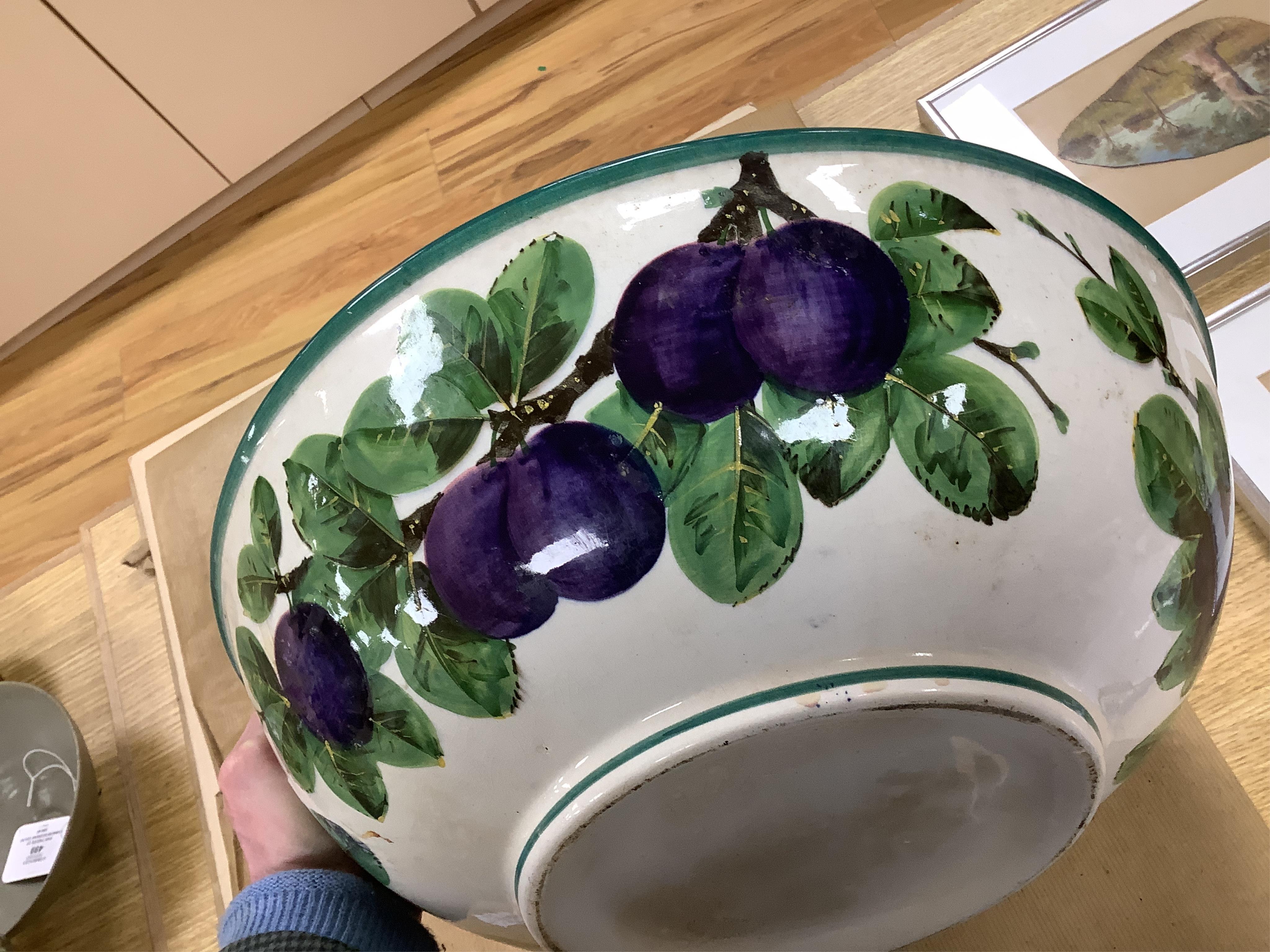 A Wemyss four-piece toilet set, a jug and basin, soap dish with liner, and bowl, damson pattern. Basin 39cm diameter., Condition - poor